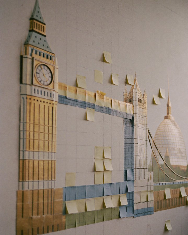 Sticky notes on a studio wall arranged into the London skyline: Big Ben, Tower Bridge and St Paul's
